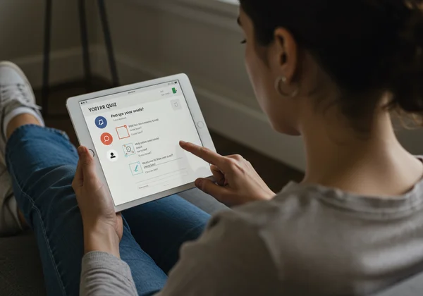 Woman taking an online self-assessment quiz on a tablet